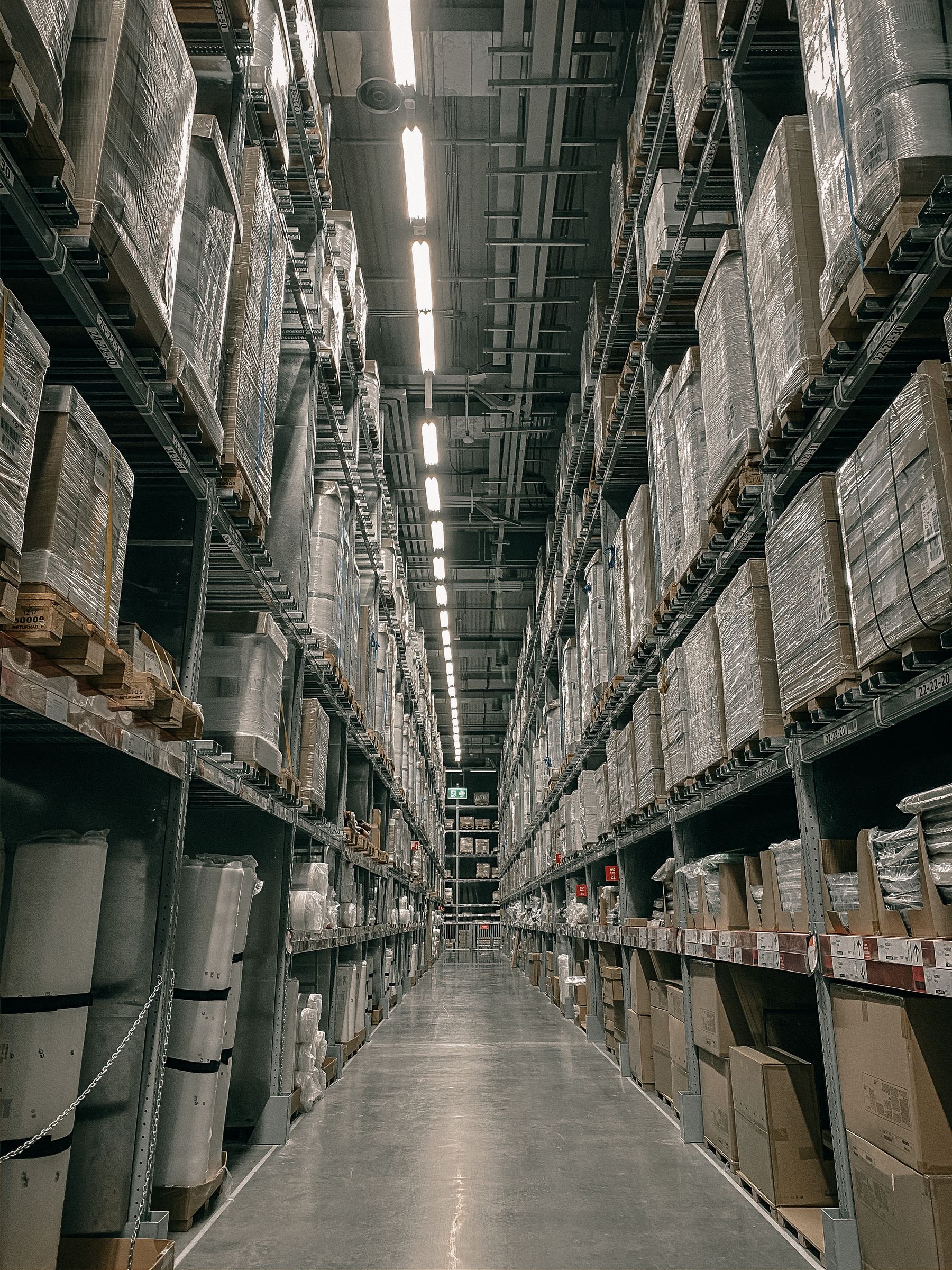 Tall storage racks lining a warehouse aisle